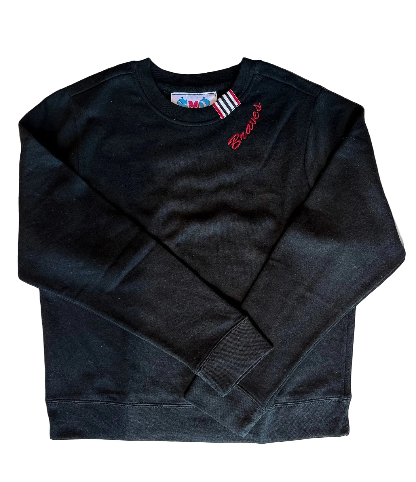 A black long-sleeve crewneck sweatshirt with red script embroidery reading 'Braves' on the left chest, laid flat on a light beige background.